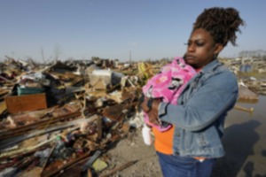 <strong>Wonder Bolden cradles her year-old granddaughter Journey Bolden as she surveys the remains of her mother's tornado demolished mobile home in Rolling Fork, Miss., Saturday March 25, 2023.</strong>&nbsp;(AP Photo/Rogelio V. Solis)