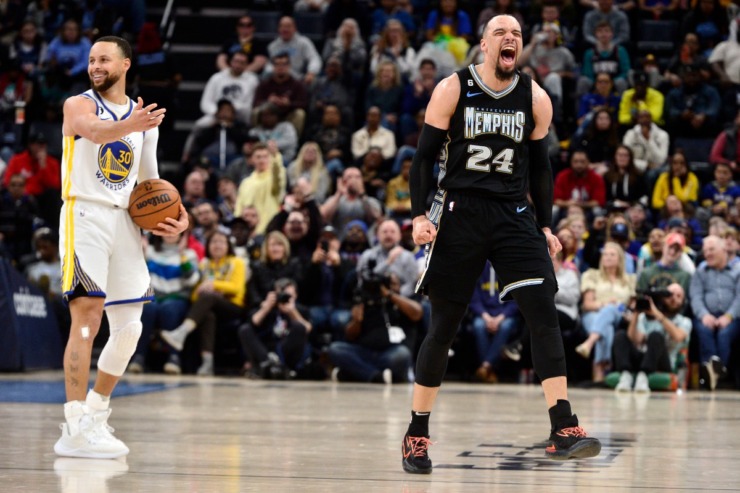 Memphis Grizzlies forward Dillon Brooks (24) and Golden State Warriors guard Stephen Curry (30) react in the first half of an NBA basketball game Thursday, March 9, 2023, in Memphis, Tenn. (AP Photo/Brandon Dill)