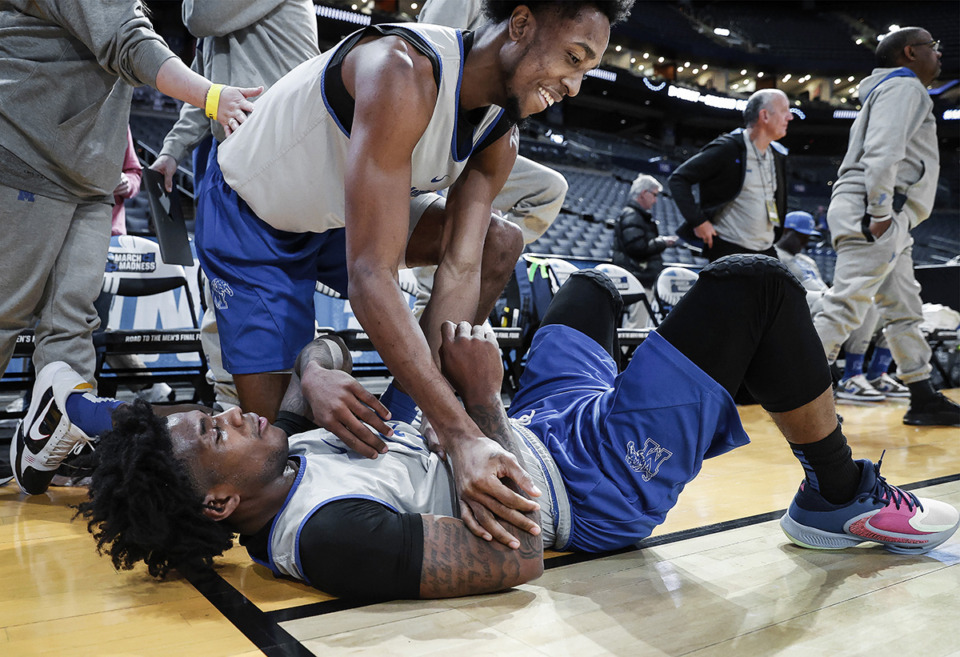 <strong>Memphis Tigers teammates DeAndre Williams (top) and Kendric Davis (bottom) joke with each other at practice during media availability at the NCAA tournament&nbsp; March 16 in Columbus, Ohio.</strong> (Mark Weber/The Daily Memphian)