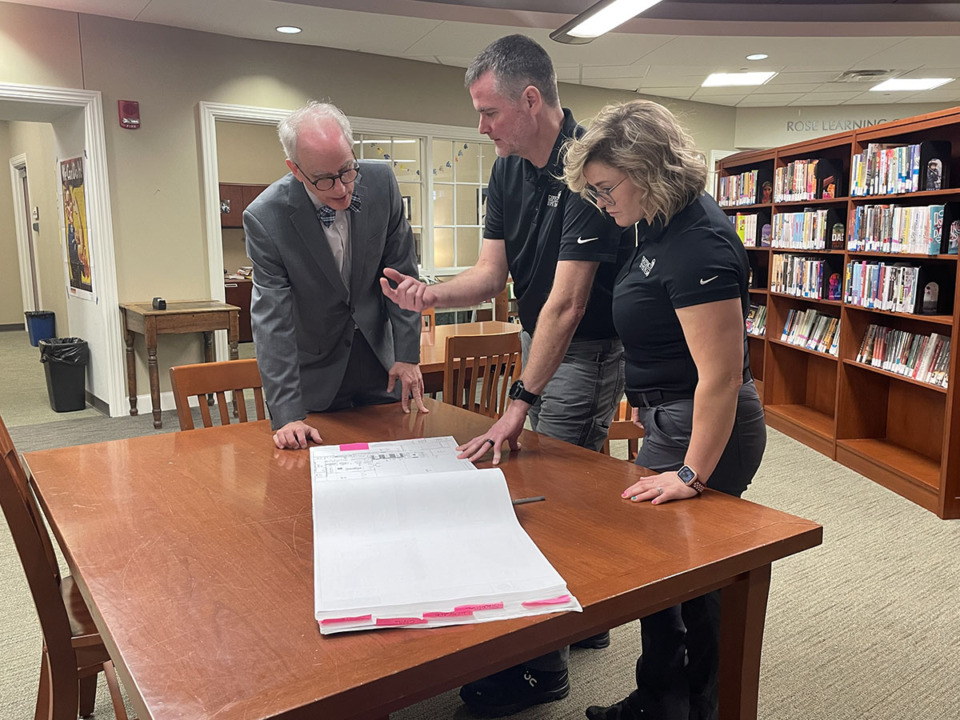 <strong>Albert Throckmorton, (left) head of school at St. Mary's Episcopal School, talks with Tracey Mendenhall (right) and Brink Fidler (center) of Defend Systems about dealing with active shooter situations.</strong> (Julia Baker/The Daily Memphian)