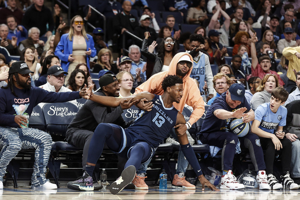 <strong>The Memphis Grizzlies have a loaded injury report ahead of tonight&rsquo;s game. Center Jaren Jackson Jr., falls in to the crowd after making a 3-pointer against the Orlando Magic during action March 28.</strong> (Mark Weber/The Daily Memphian)