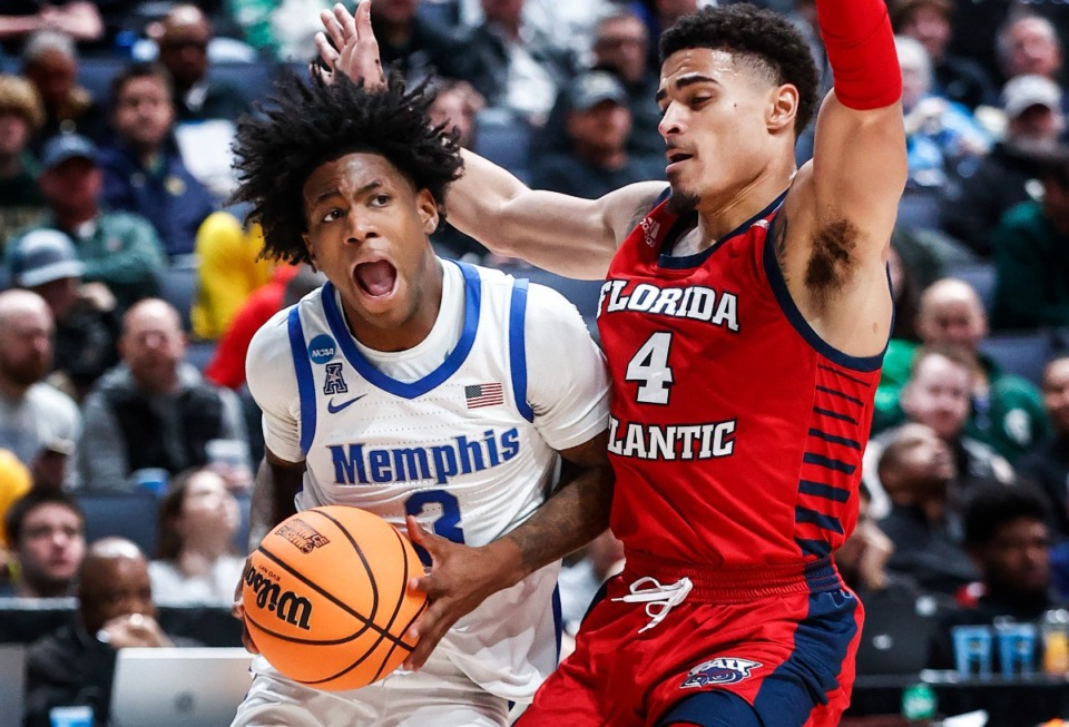 <strong>University of Memphis guard Kendric Davis (left) drives the lane against Florida Atlantic University defender Bryan Greenlee (right) during action in their NCAA tournament game on Friday, March 17, 2023 in Columbus, Ohio.</strong> (Mark Weber/The Daily Memphian)
