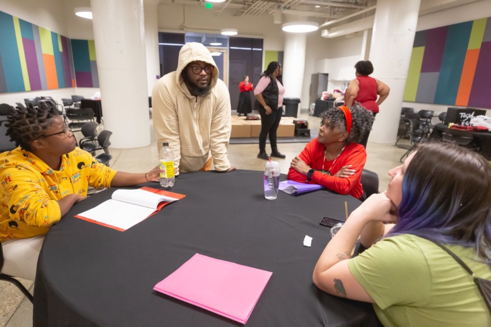 <strong>Director Zhailon Levingston (center) speaks with actors and crew members (right to left) Emily Rooker, Niambi D. Webster, and Dan&eacute;t James during rehearsal of The InHEIRitance Project&rsquo;s &ldquo;Exodus,&rdquo; at Crosstown Concourse on Wednesday, March 29, 2023.</strong> (Ziggy Mack/Special to The Daily Memphian)