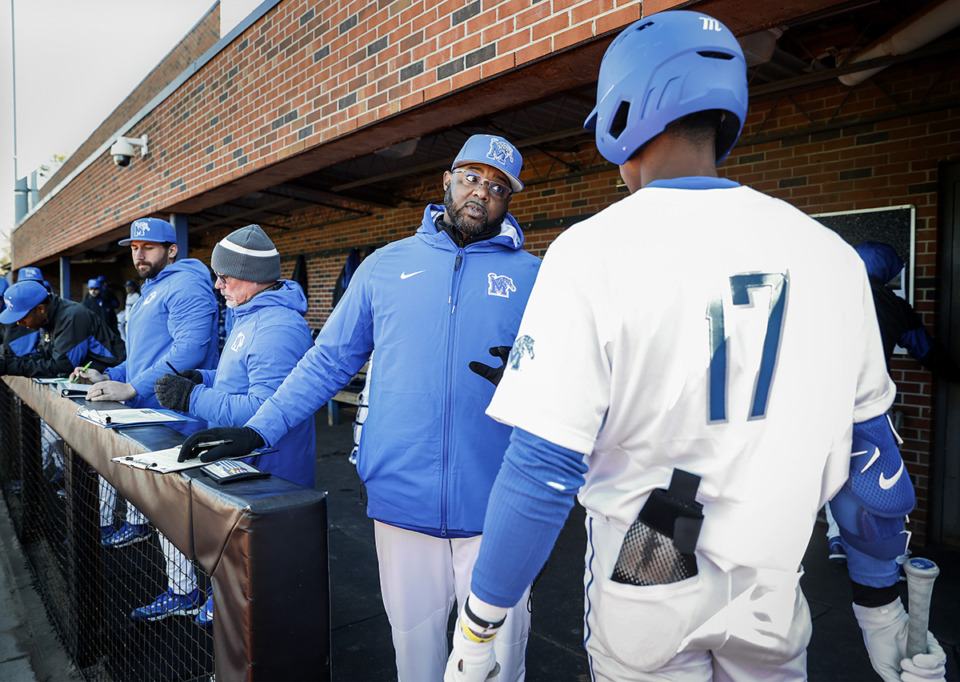 <strong>University of Memphis baseball coach Kerrick Jackson (middle) chats with hitter Cameron Benson (right) in the dugout during action against Samford on Friday, February 17, 2023.</strong> (Mark Weber/The Daily Memphian file)