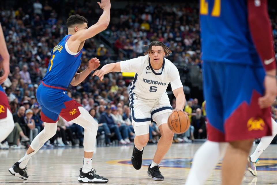 <strong>Memphis Grizzlies forward Kenneth Lofton Jr. (6) and Denver Nuggets forward Michael Porter Jr. (1) in the second half of an NBA basketball game Friday, March 3, 2023, in Denver.</strong> (AP Photo/David Zalubowski)