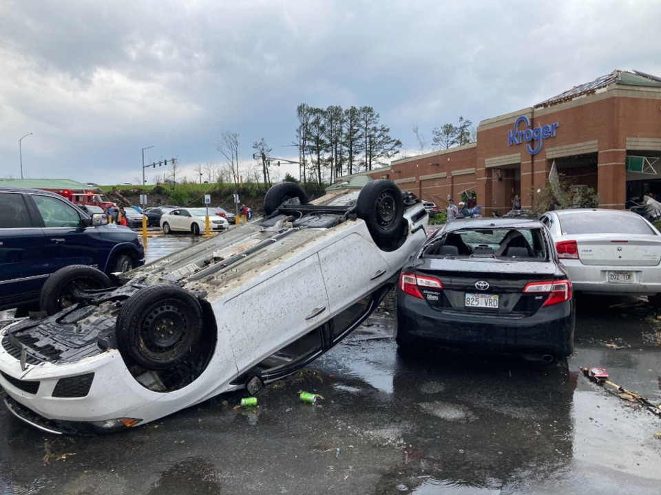 <strong>A car is upturned in a Kroger parking lot after a severe storm swept through Little Rock, Ark., Friday, March 31, 2023.</strong> (AP Photo/Andrew DeMillo)