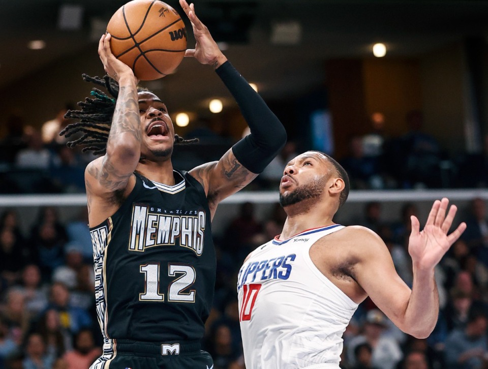 <strong>Memphis Grizzlies guard Ja Morant (left) shoots over Los Angeles Clippers&rsquo; Eric Gordon (right) on Friday, March 31, 2023.</strong> (Mark Weber/The Daily Memphian)