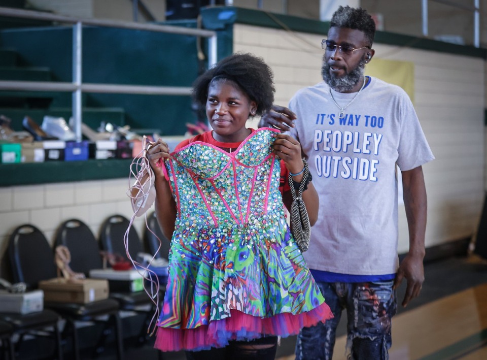 <strong>Arbre Williams shows off a dress while shopping for prom clothes with her dad, Benjamin Williams Sr., at the Memphis Police Department&rsquo;s Prom Closet on April 1, 2023.</strong> (Patrick Lantrip/The Daily Memphian)