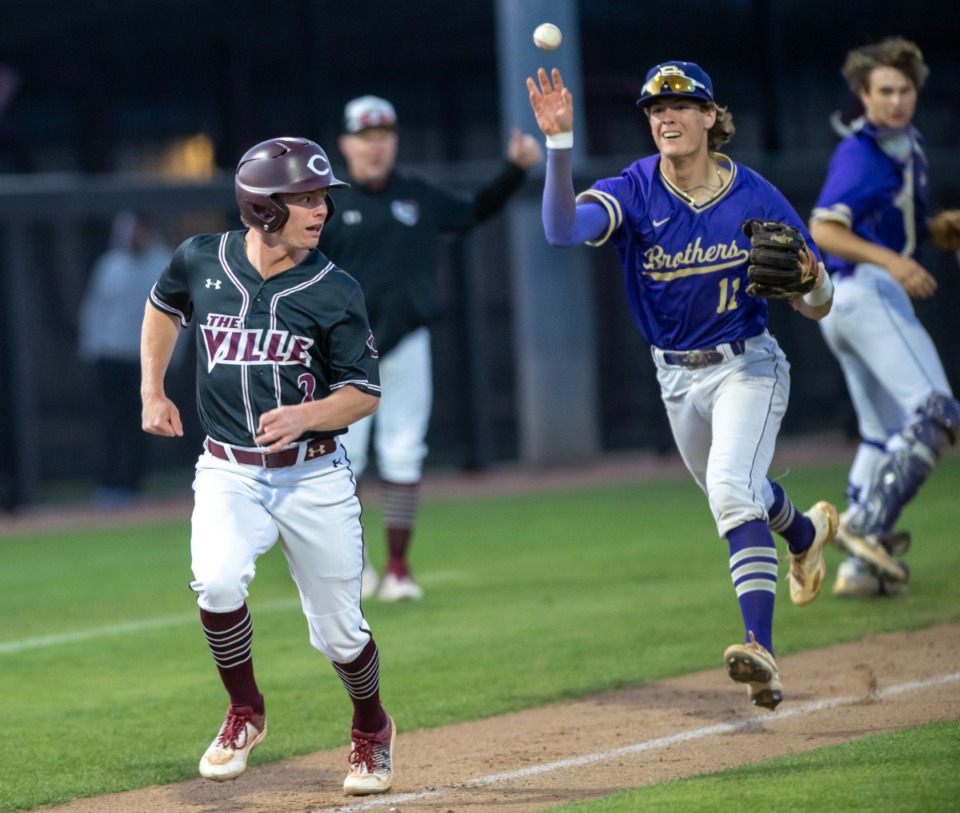 <strong>Collierville shortstop is boxed-in between 3rd and home by Trenton Lyons of CBHS during the second inning of action.</strong> (Greg Campbell/Special to The Daily Memphian file)