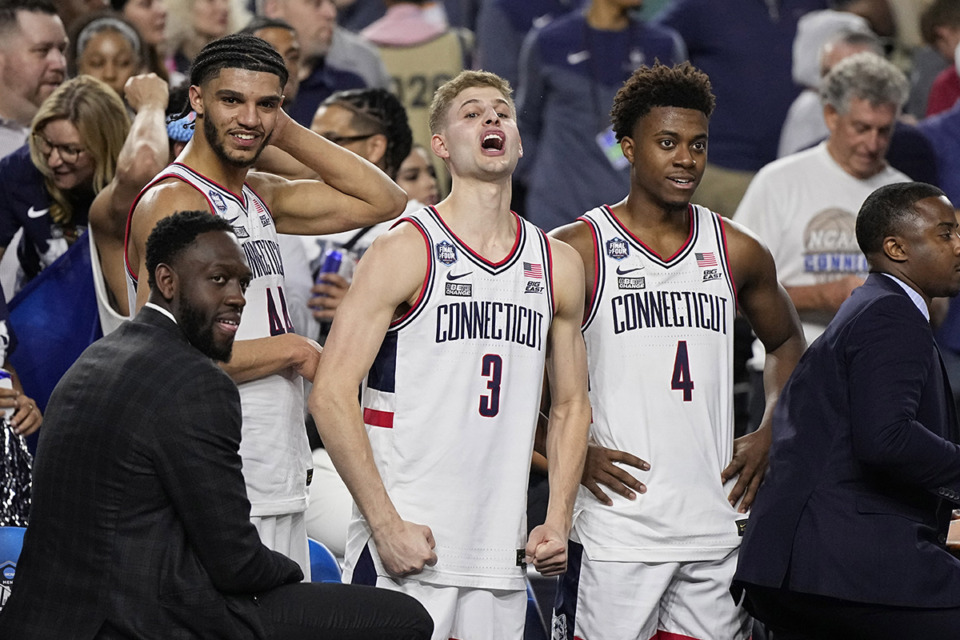 <strong>Connecticut guard Joey Calcaterra (3) celebrates after their win against Miami in a Final Four college basketball game in the NCAA Tournament April 1 in Houston.</strong> (Brynn Anderson/AP Photo)