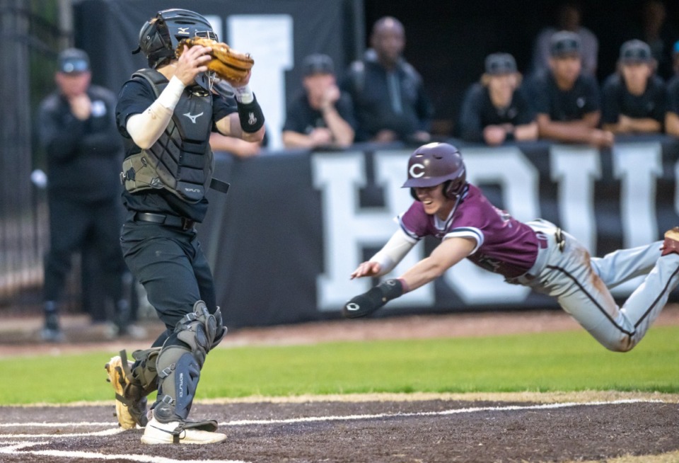 <strong>Collierville pinch runner Gavin Gresham dives for home plate as Houston's catcher Sam Smith moves for the tag.</strong> <strong>Gresham was safe at home.</strong> (Greg Campbell/Special to The Daily Memphian)