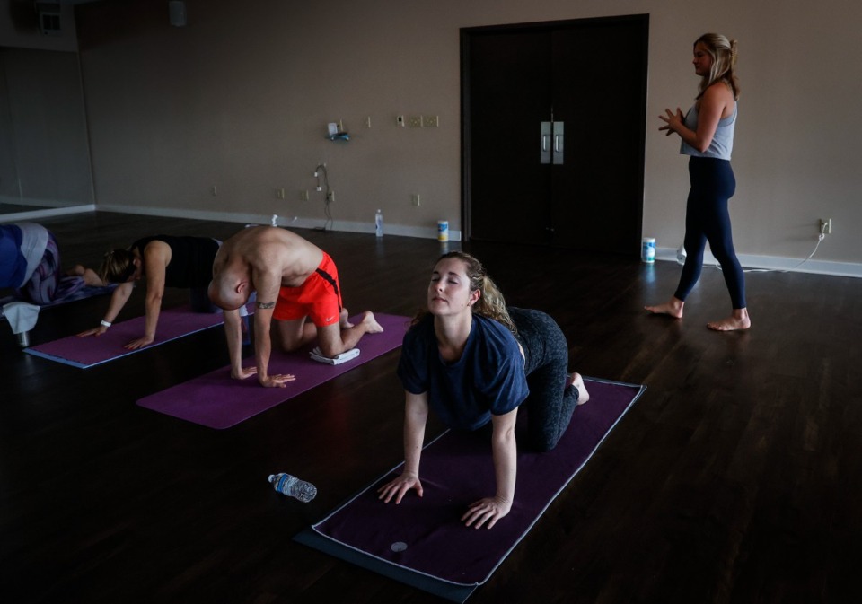 <strong>Participants stretch during a hot yoga class at SANA Yoga on Monday, April 3, 2023.</strong> (Mark Weber/The Daily Memphian)