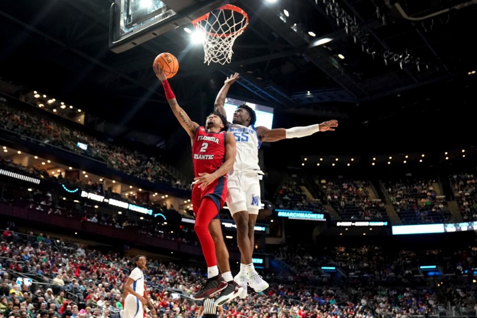 <strong>Florida Atlantic guard Nicholas Boyd (2) drives on Memphis Tigers guard Damaria Franklin (55) in the first half of a first-round college basketball game in the NCAA Tournament Friday, March 17, 2023, in Columbus, Ohio.</strong> (AP Photo/Paul Sancya)