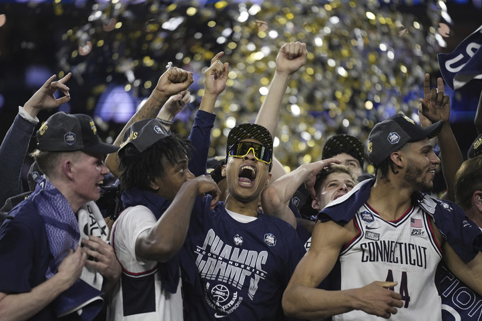 <strong>Connecticut players celebrate after the men's national championship college basketball game against San Diego State in the NCAA Tournament on Monday, April 3, 2023, in Houston.</strong> (Brynn Anderson/AP Photo)