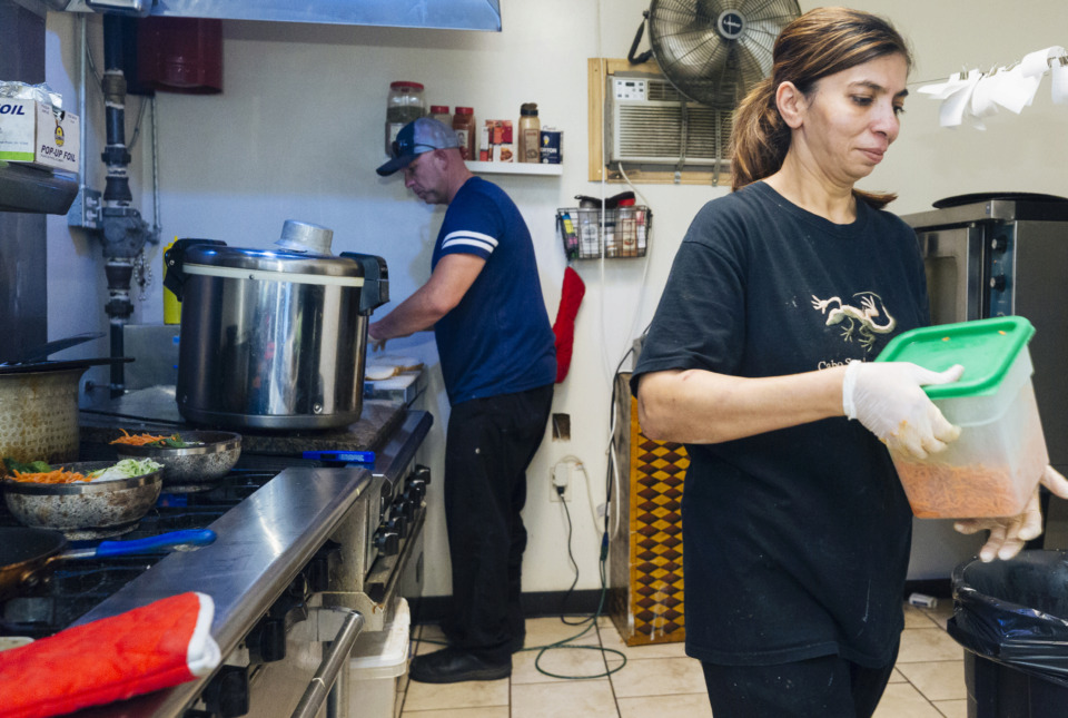 <strong>Owner Brad Wilbanks and his wife,&nbsp; Shamira Wilbanks, prepare food in the kitchen of Sam's Deli on South Highland.&nbsp;</strong>(Ziggy Mack/Special to The Daily Memphian)&nbsp;