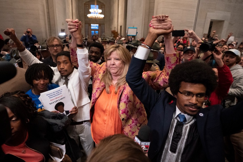 <strong>Former Rep. Justin Jones, D-Nashville, Rep. Gloria Johnson, D-Knoxville, and former Rep. Justin Pearson, D-Memphis, raises their hands outside the House chamber after Jones and Pearson were expelled from the legislature Thursday, April 6, 2023, in Nashville.</strong> (AP Photo/George Walker IV)