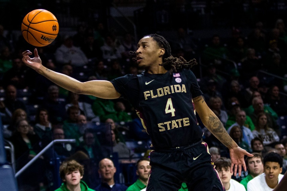<strong>Florida State's Caleb Mills (4) grabs a loose ball during the first half of an NCAA college basketball game against Notre Dame Tuesday, Jan. 17, 2023, in South Bend, Ind.</strong> (AP Photo/Michael Caterina)