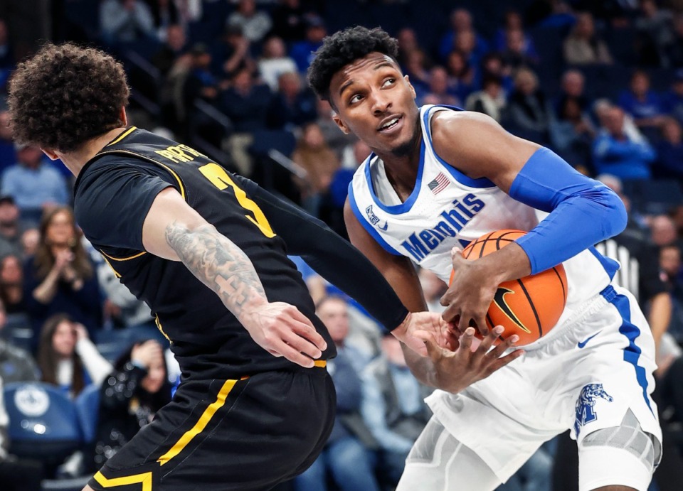 <strong>Tigers guard Keont&eacute; Kennedy (right) grabs a loose ball away from Wichita State defender Craig Porter Jr. (left) during action on Jan. 19, 2023.</strong> (Mark Weber/The Daily Memphian file)