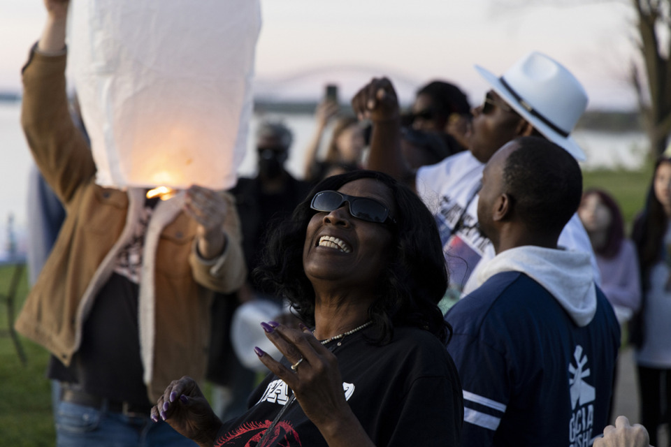 <strong>RowVaughn Wells, Tyre Nichols&rsquo;s mother, smiles while watching a lantern float into the sky during a sunset send-off lantern release in honor of Tyre Nichols at Martrys Park April 9.</strong> (Brad Vest/Special to The Daily Memphian)