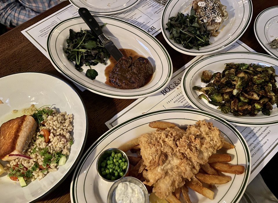 <strong>Clockwise from left: roasted Scottish salmon, filet, cabbage steak, Brussels sprouts and fish &lsquo;n chips.</strong> (Jennifer Biggs/The Daily Memphian)