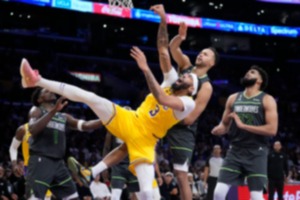 <strong>Los Angeles Lakers forward Anthony Davis (3) is defended by Minnesota Timberwolves guard Anthony Edwards (1), forward Kyle Anderson and forward center Karl-Anthony Towns (32) on April 11, 2023, in Los Angeles.</strong> (Marcio Jose Sanchez/AP)