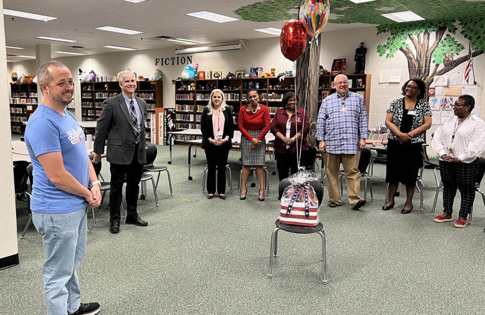 <strong>Collierville Schools leaders surprised West Collierville Principal Tyler Salyer (left) on Thursday. Salyer is a National Distinguished Principal for 2023 through the National Association of Elementary School principals.</strong> (Courtesy Collierville Schools)
