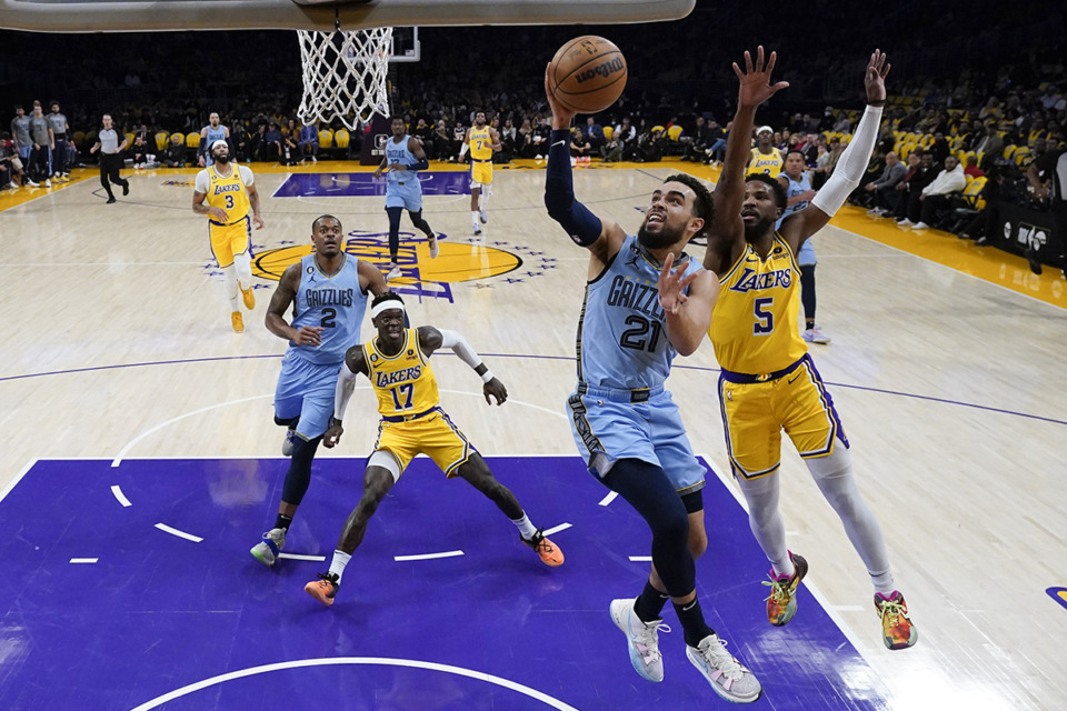 <strong>Memphis Grizzlies' Tyus Jones (21) puts up a shot past Los Angeles Lakers' Malik Beasley (5) during the first half of a game March 7, 2023, in Los Angeles.</strong> (Jae C. Hong/AP Photo file)