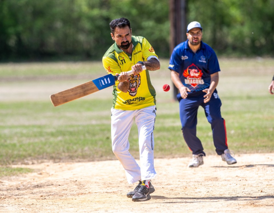 <strong>A batsman swings after the bowler delivers the ball in cricket at Nikki McCray Park in Collierville. The 21 Collierville teams are asking the town council to provide a permanent field for them to play. </strong>(Greg Campbell/Special to The Daily Memphian)