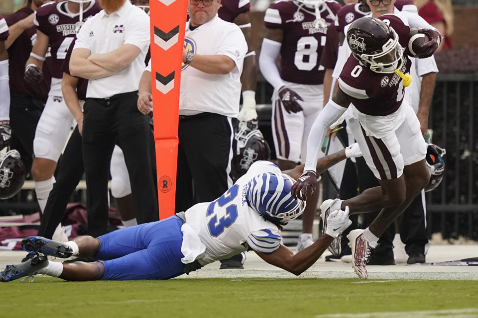 <strong>Mississippi State wide receiver Rara Thomas (0) is tripped up by Memphis defensive back Ladarian Paulk (23) during the first half of an NCAA college football game in Starkville, Miss., Sept. 3, 2022.</strong> (Rogelio V. Solis/AP file)