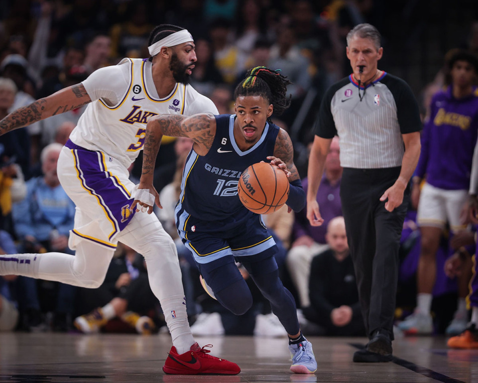 <strong>Memphis Grizzlies guard Ja Morant (12) grabs a loose rebound from Los Angeles Lakers forward Anthony Davis (3).</strong>&nbsp;(Patrick Lantrip/The Daily Memphian)