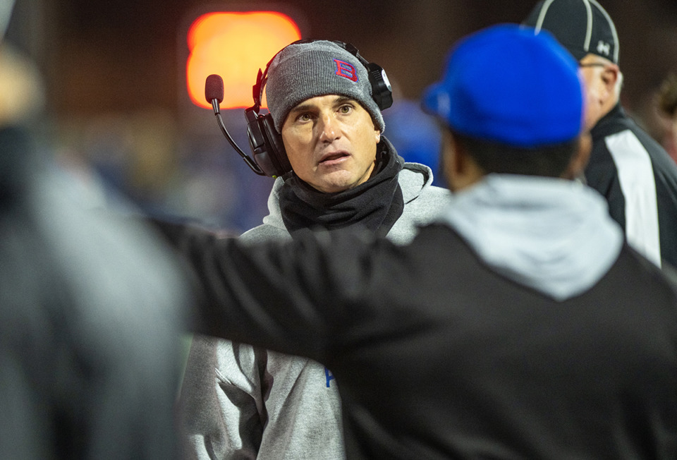 <strong>Bartlett High School head coach Lance Tucker talks with assistant coaches in the first half of the 6A semifinal game against Beech High School at Bartlett High School Nov. 25, 2022.</strong> (Greg Campbell/Special to The Daily Memphian)