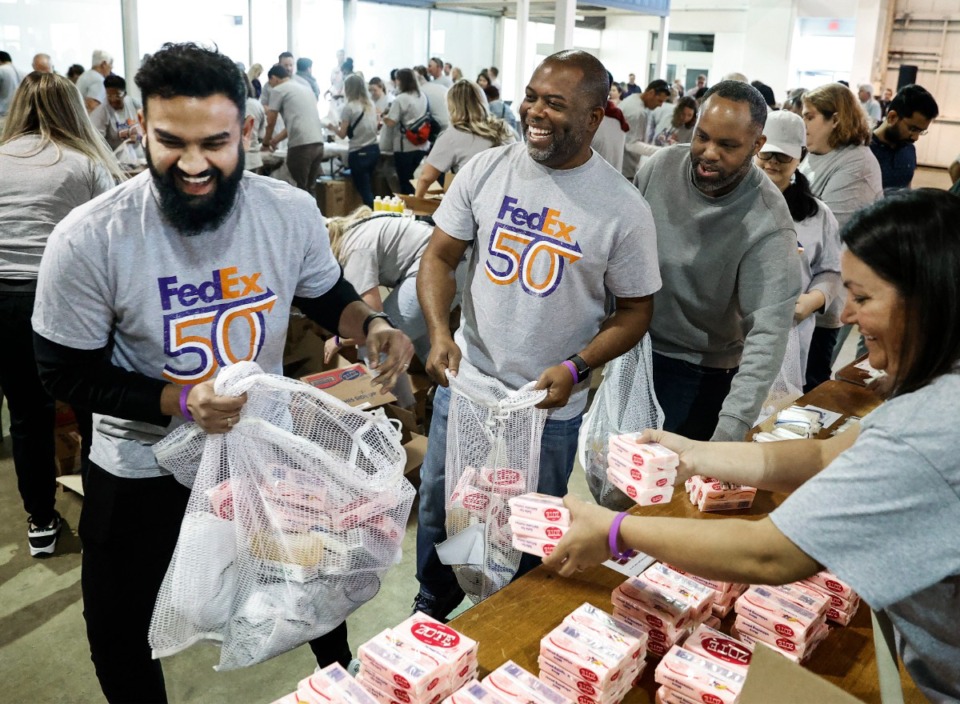 <strong>FedEx employees put together household hygiene kits for the International Medical Corps during a FedEx Cares event April 17.</strong> (Mark Weber/The Daily Memphian)
