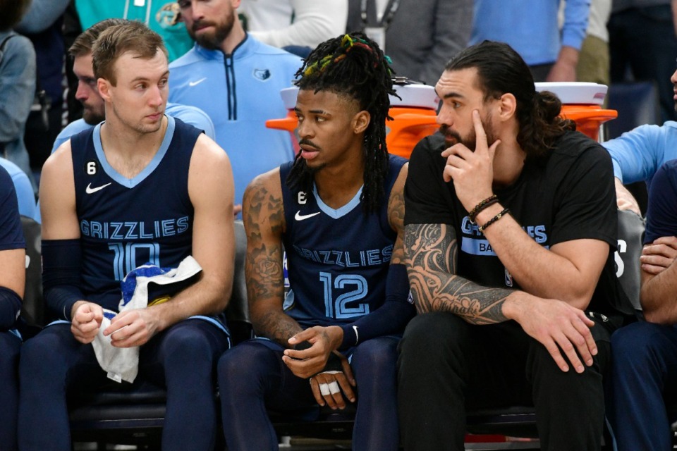 <strong>Memphis Grizzlies guard Ja Morant (12) sits between guard Luke Kennard (10) and center Steven Adams during Game 1 of a first-round NBA basketball playoff series against the Los Angeles Lakers, Sunday, April 16, 2023, in Memphis.</strong> (Brandon Dill/AP Photo)
