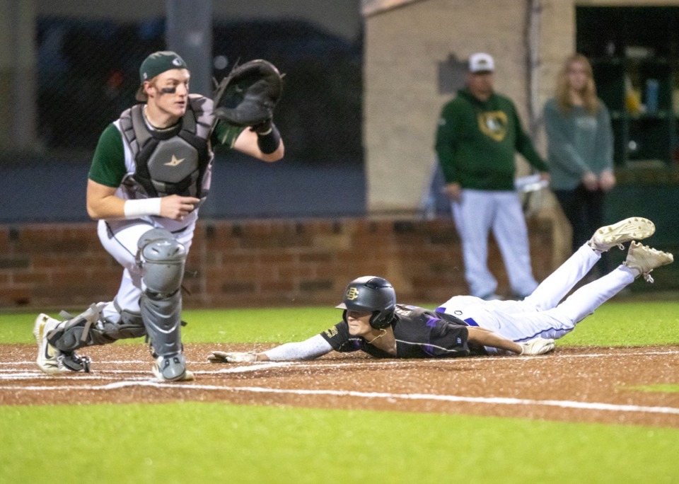 <strong>CBHS' Boston Barker slides into home as Briarcrest's catcher, Thomas Ray waits for the fielded ball. CBHS went on to defeat Briarcrest 8-0.</strong> (Greg Campbell/Special to The Daily Memphian)