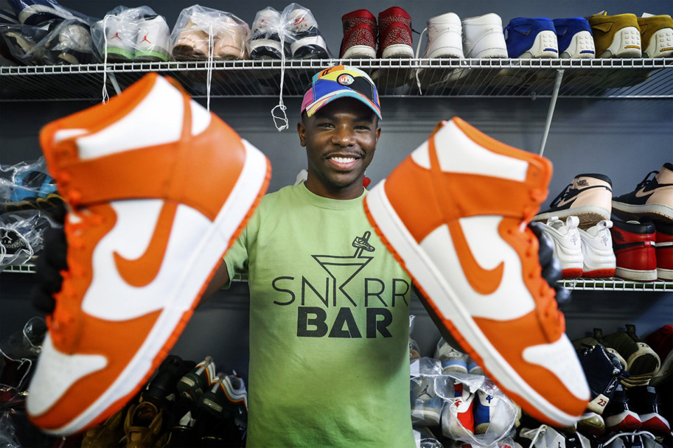 <strong>Snkrr Bar founder Dominique Worthen shows off a pair restored Air Jordans on Aug. 30, 2021.</strong> (Mark Weber/The Daily Memphian file)