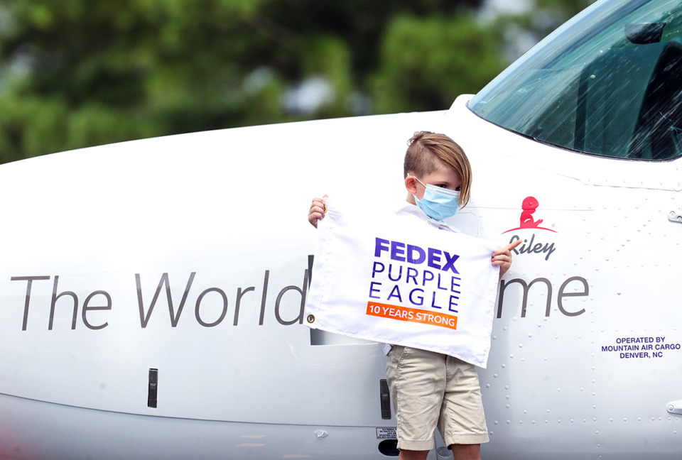 <strong>Riley, a young St. Jude patient, shows off a FedEx Cessna Caravan that was named in his honor at the FedEx St. Jude Championship Aug. 10, 2022.</strong> (Patrick Lantrip/The Daily Memphian file)