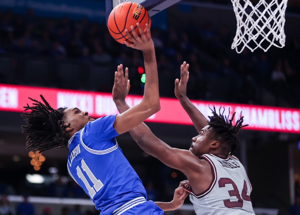 <strong>University of Memphis guard Johnathan Lawson (11) goes up for a layup during a Dec. 17, 2022 game against Texas A&amp;M University. The two teams will face off again in December 2023. (</strong>Patrick Lantrip/Daily Memphian file)
