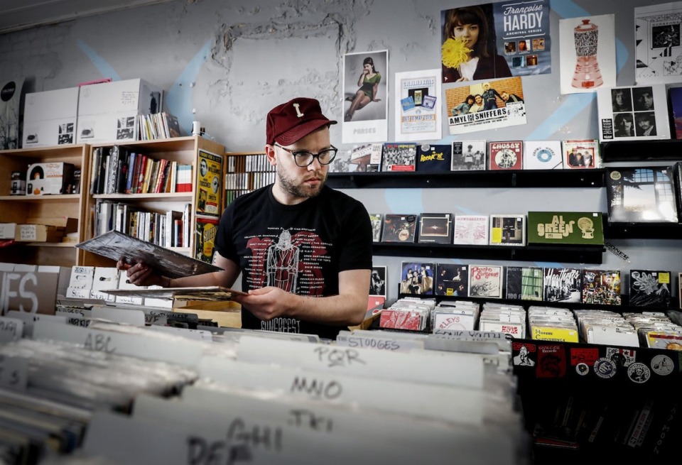 <strong>Goner Records&rsquo; Cole Wheeler stocks albums in the record store April 16, 2020 in Cooper-Young.&nbsp;Goner Records is located at 2152 Young Ave.</strong> (Mark Weber/The Daily Memphian file)