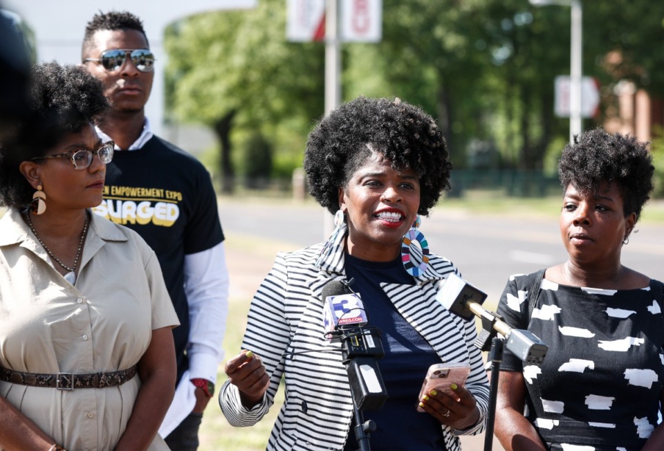 <strong>Rachael Springs (middle) speaks the to media outside Memphis Shelby County Schools asking that school board re-convene the super search advisory committee and adopt a "community search plan" for hiring a new superintendent on Thursday, April 20, 2023.</strong> (Mark Weber/The Daily Memphian)