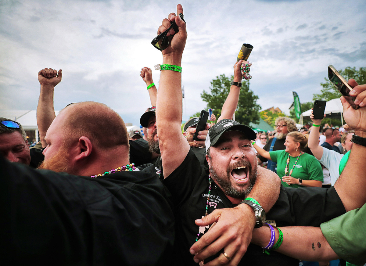 <strong>Hometown BBQ team members celebrate their win in the whole hog division during the awards ceremony on the final day of the 2019 Memphis in May World Championship Barbecue Cooking Contest at Tom Lee Park on May, 18, 2019.</strong> (Jim Weber/Daily Memphian)