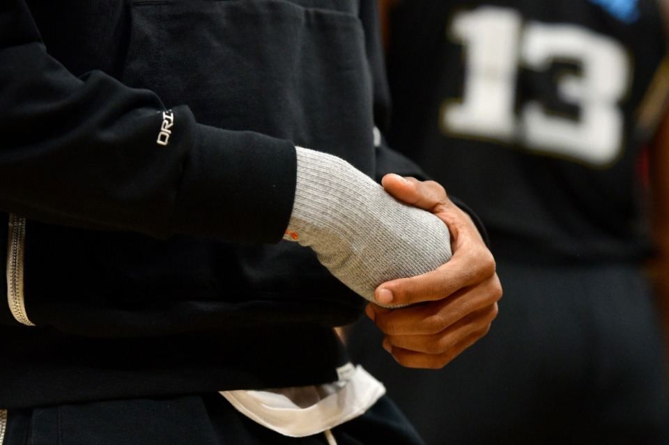 <strong>Memphis Grizzlies guard Ja Morant holds his injured hand during the first half in Game 2 of the team's playoff series against the Los Angeles Lakers on Wednesday, April 19, 2023. Morant&rsquo;s hand was originally injured in a game against the Milwaukee Bucks during the regular season.&nbsp;</strong>(Brandon Dill/AP file)