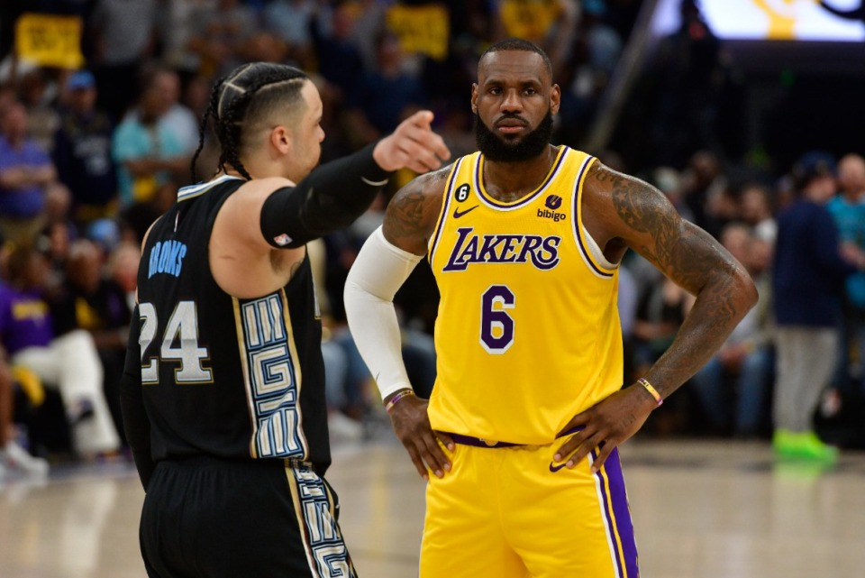 <strong>Memphis Grizzlies forward Dillon Brooks (24) talks to Los Angeles Lakers forward LeBron James (6) during Game 2 of the playoff series Wednesday, April 19, 2023.</strong> (Brandon Dill/AP file)