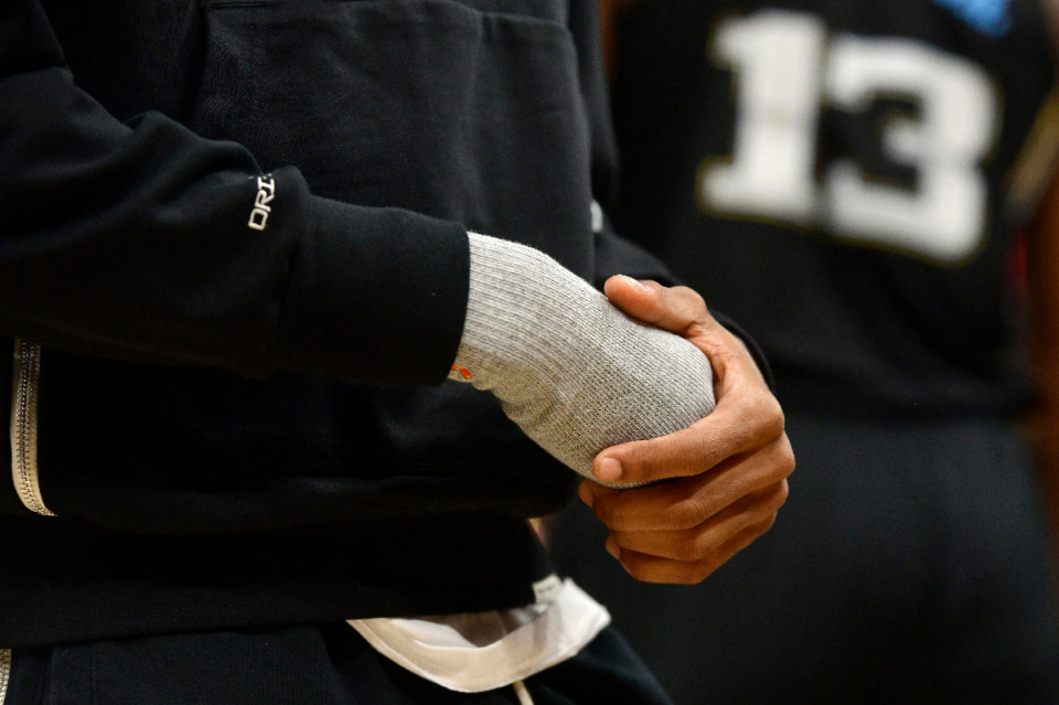 <strong>Memphis Grizzlies guard Ja Morant holds his injured hand during the first half in Game 2 of the team's first-round NBA basketball playoff series against the Los Angeles Lakers on Wednesday, April 19, 2023, in Memphis.</strong> (Brandon Dill/AP)