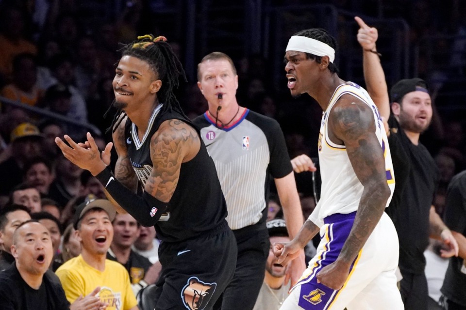 <strong>Memphis Grizzlies guard Ja Morant and Los Angeles Lakers forward Jarred Vanderbilt react after Morant lost the ball out of bounds during the first half in Game 3 of a first-round NBA basketball playoff series Saturday, April 22, 2023, in Los Angeles.</strong> (Mark J. Terrill/AP)