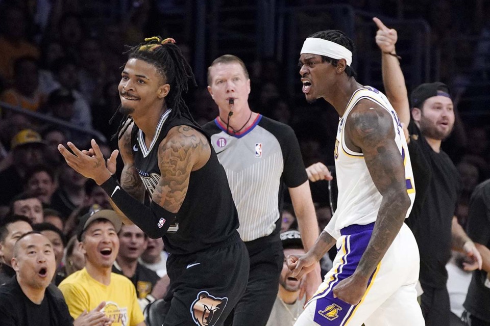 <strong>Memphis Grizzlies guard Ja Morant, left, and Los Angeles Lakers forward Jarred Vanderbilt, right, reacts after Morant lost the ball out of bounds during the first half in Game 3 of a first-round NBA basketball playoff series Saturday, April 22, 2023, in Los Angeles.</strong> (AP Photo/Mark J. Terrill)