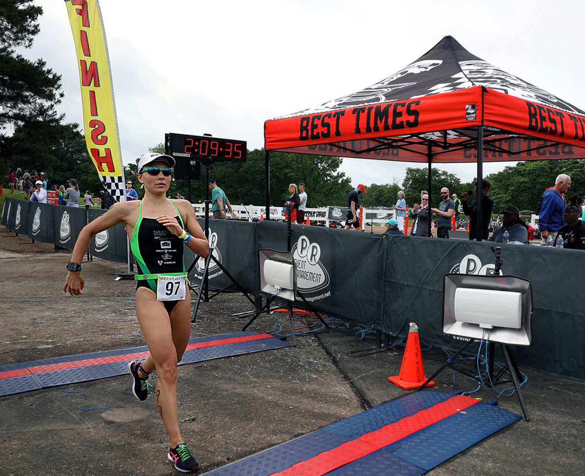 <strong>While she wasn&rsquo;t allowed to officially qualify for the Memphis in May Olympic Triathlon, local pro triathlete Laura Mathews was the first woman to cross the finish line on Sunday, May 19, in Orgill Park in Millington.</strong> (Patrick Lantrip/Daily Memphian)