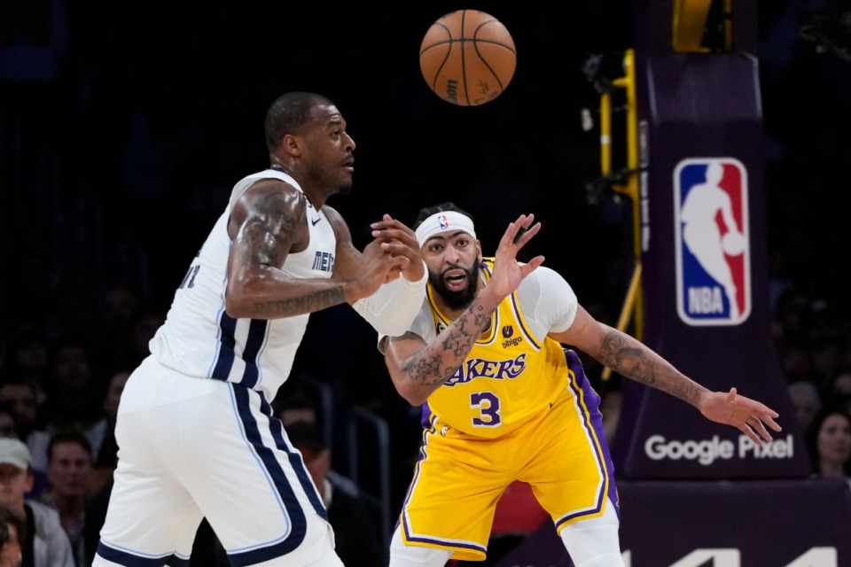 <strong>Memphis Grizzlies center Xavier Tillman Sr., left, is defended by Los Angeles Lakers forward Anthony Davis (3) on April 24, 2023, in Los Angeles.</strong> (Jae C. Hong/AP)