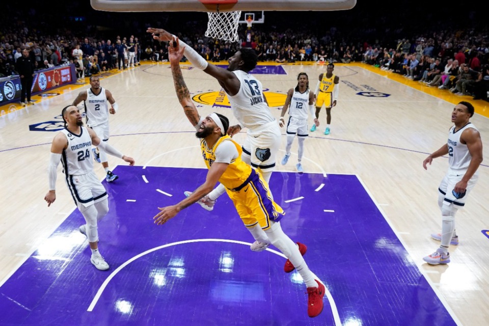 <strong>Memphis Grizzlies' Jaren Jackson Jr., top center, defends Los Angeles Lakers' Anthony Davis during overtime in Game 4 of a first-round NBA basketball playoff series Monday, April 24, 2023, in Los Angeles. The Lakers won 117-111.</strong> (AP Photo/Jae C. Hong)