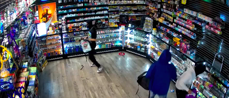 <strong>These suspects are caught on camera burglarizing Buzzin Smoke Shop near the intersection of Sycamore View and Macon roads.</strong> (Memphis Police Department Facebook video screenshot)