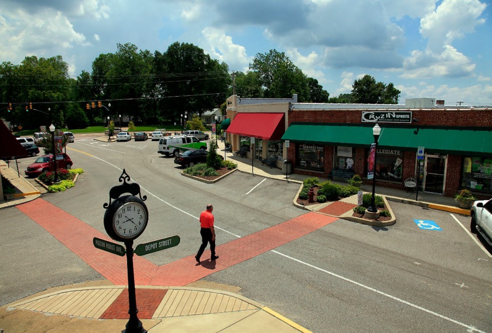 <strong>A resident crosses the street in Olive Branch&rsquo;s Old Towne.&nbsp;Olive Branch officials are using a boatload of community events to put a spotlight on the city&rsquo;s special year. </strong>(The Daily Memphian file)